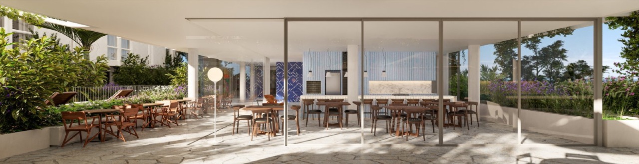 Espaço gourmet com mesas e vista do jardim (imagem ilustrativa)
