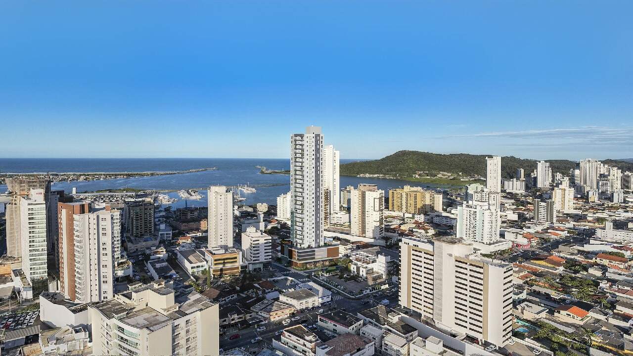 Vista aérea do bairro Fazenda com o Monte Viso, a Marina Itajaí e o mar ao fundo (fotomontagem)