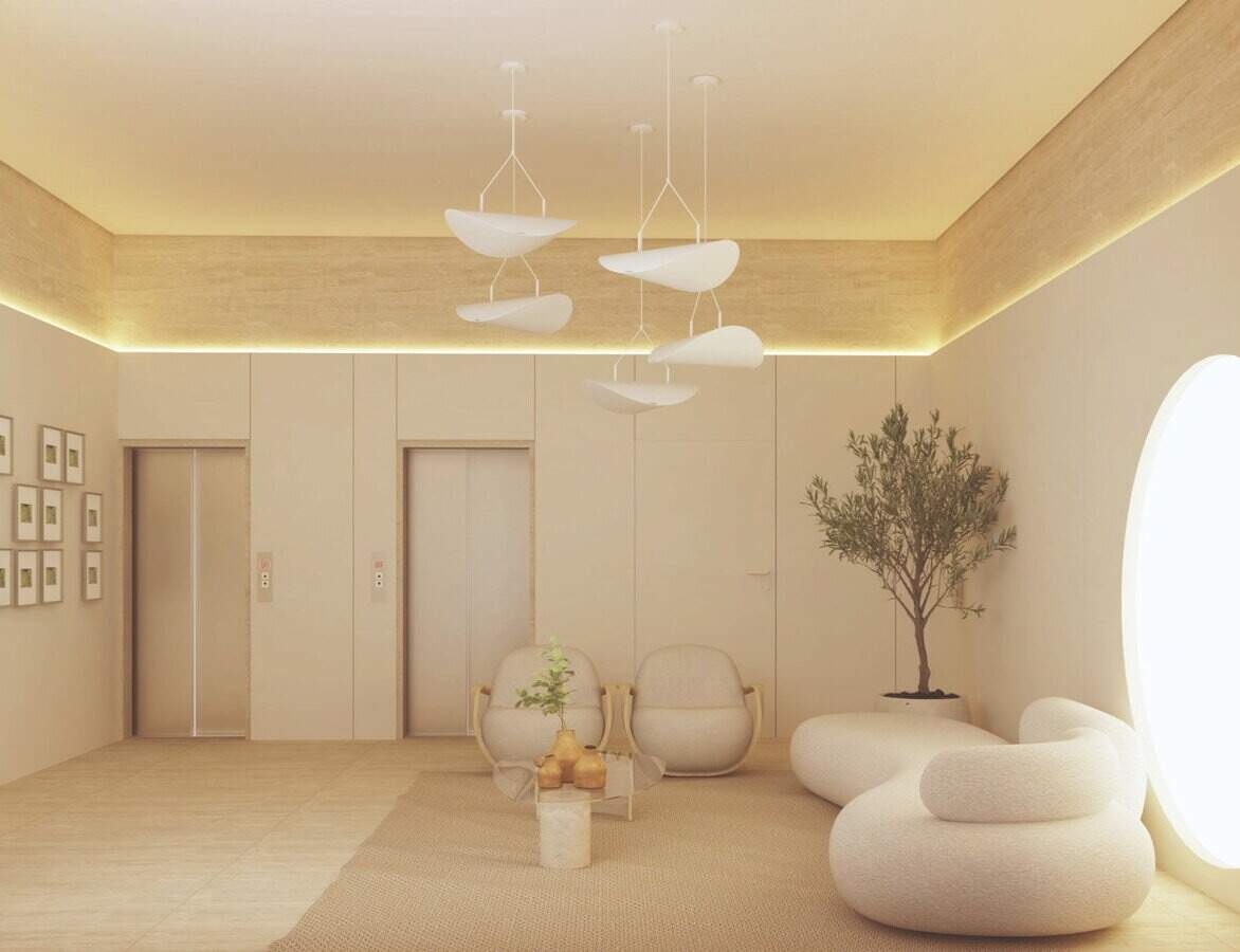 Hall dos elevadores com estar e poltronas no Aura Living Home (imagem ilustrativa)