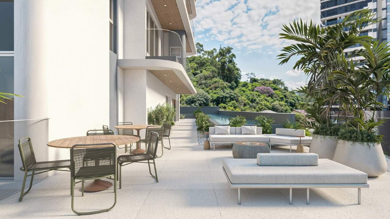 Terraço do lazer com mesas, sofás e plantas (imagem ilustrativa)