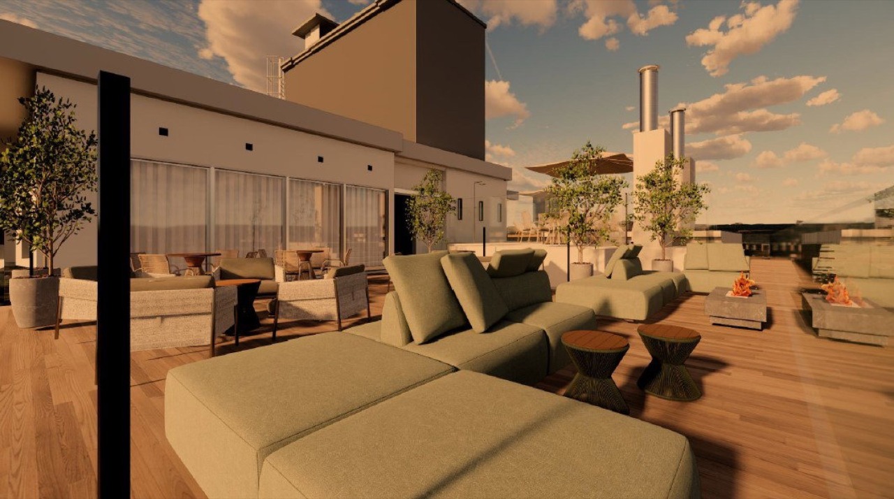 Terraço com lounge no rooftop ao entardecer (imagem ilustrativa)