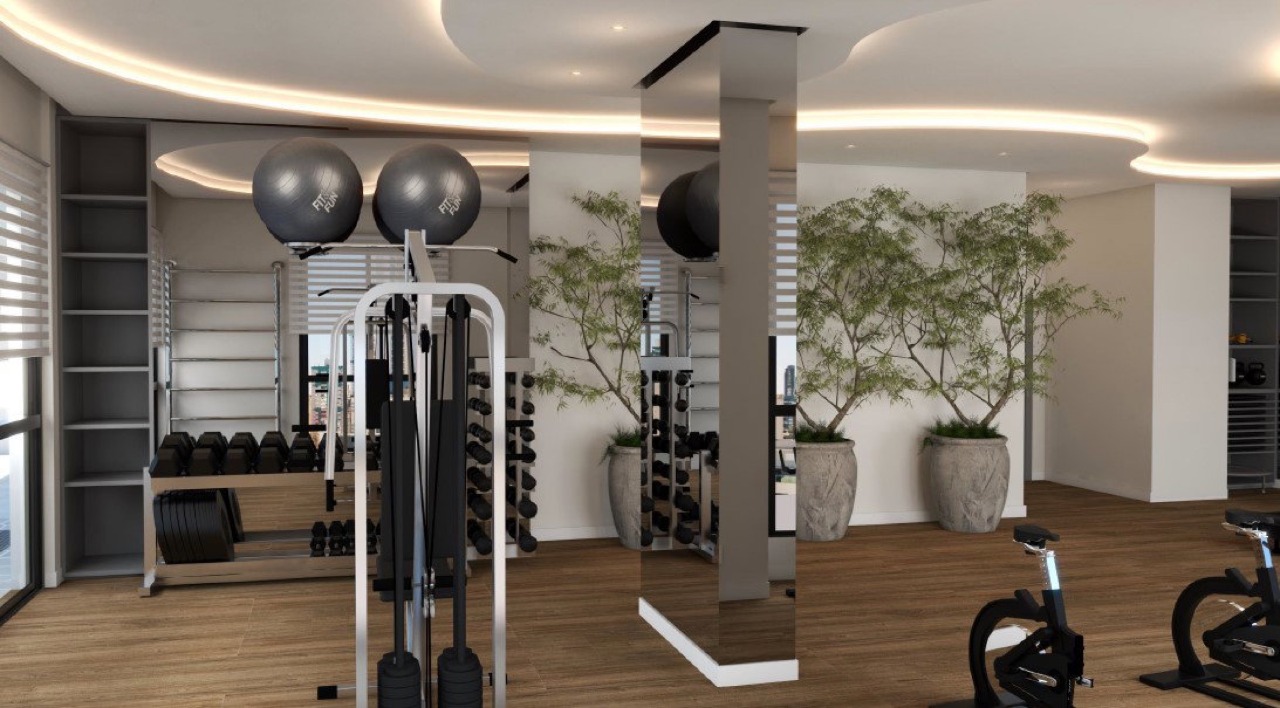 Espaço fitness com aparelhos de musculação (imagem ilustrativa)