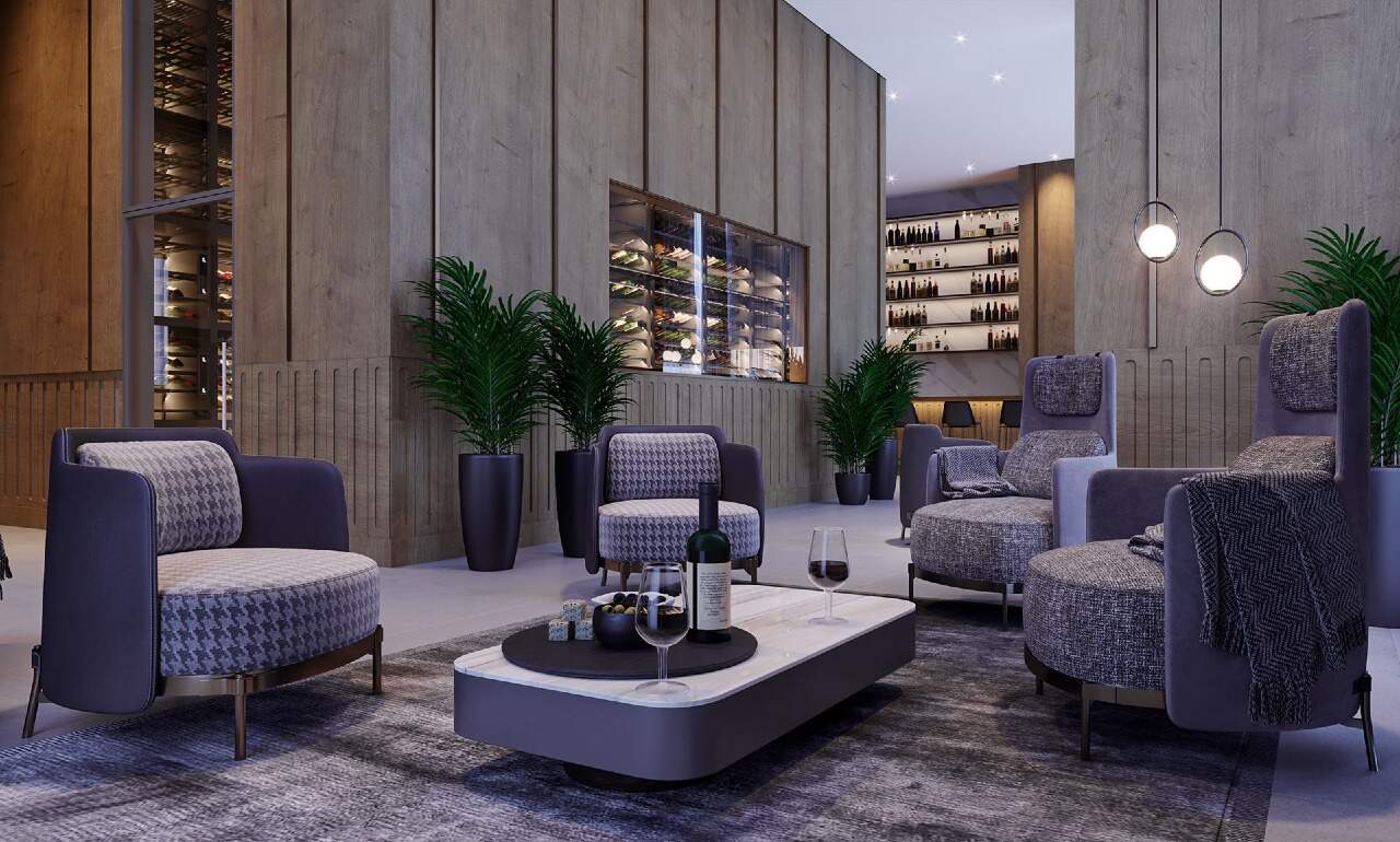 Wine bar com poltronas e garrafas expostas (imagem ilustrativa)