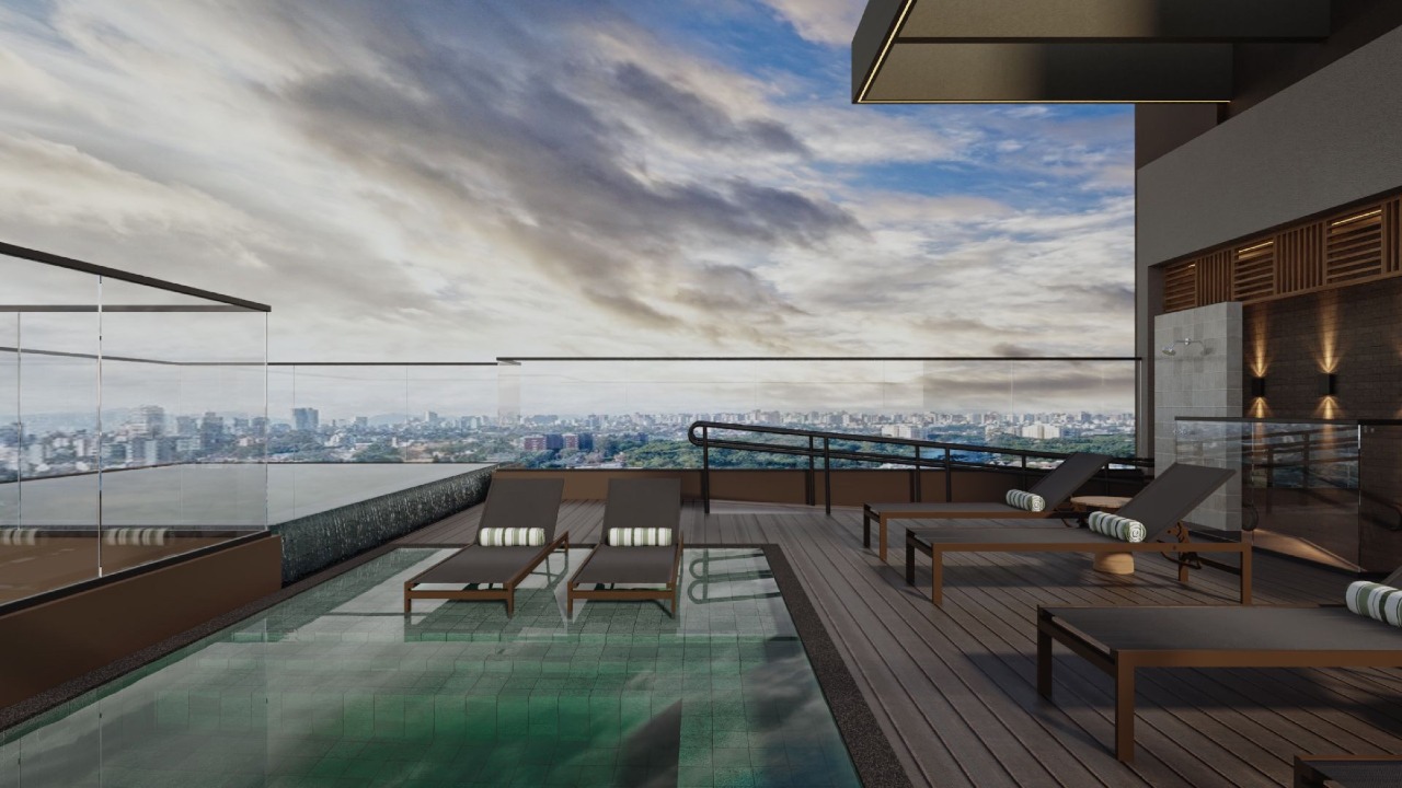 Deck do rooftop com espreguiçadeiras dentro da piscina (imagem ilustrativa)