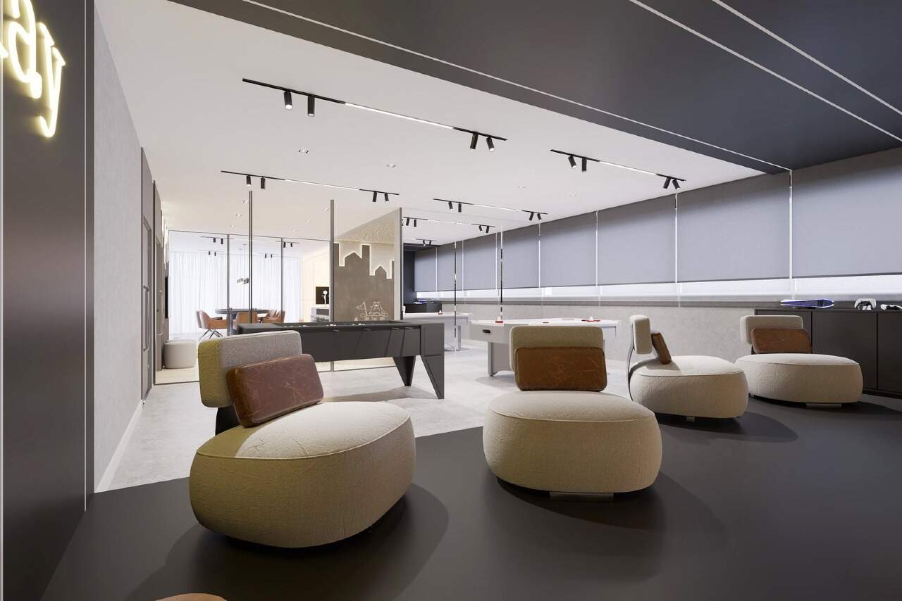 Lounge com poltronas no espaço de jogos (imagem ilustrativa)