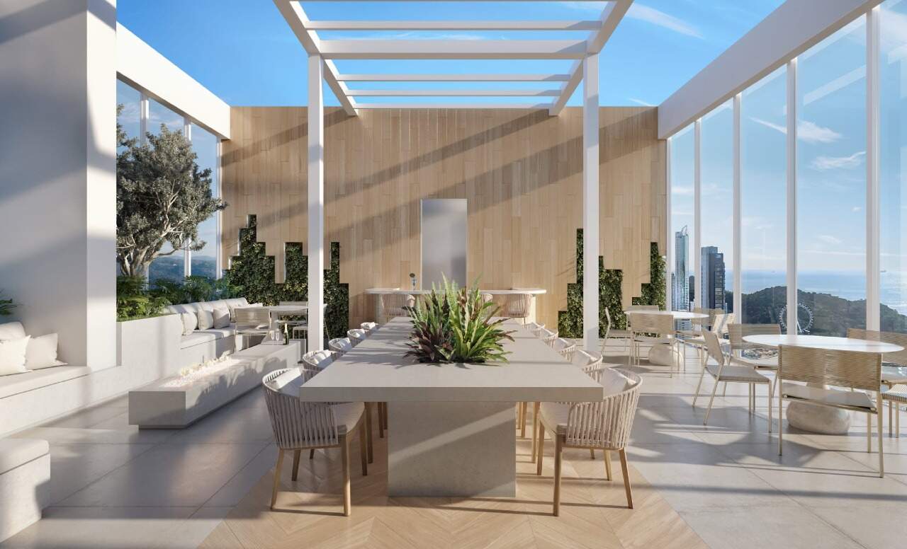 Rooftop com pergolado, mesa comunitária e vista da cidade (imagem ilustrativa)