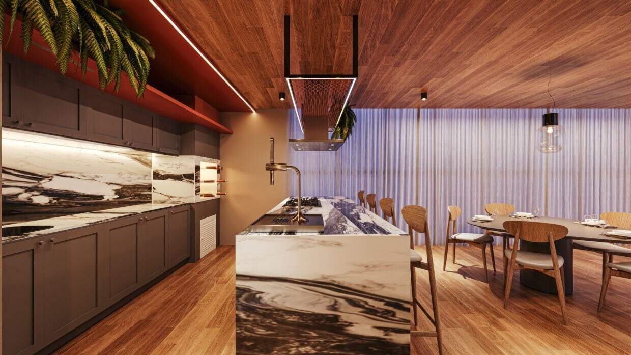 Cozinha do espaço gourmet com bancada em pedra (imagem ilustrativa)