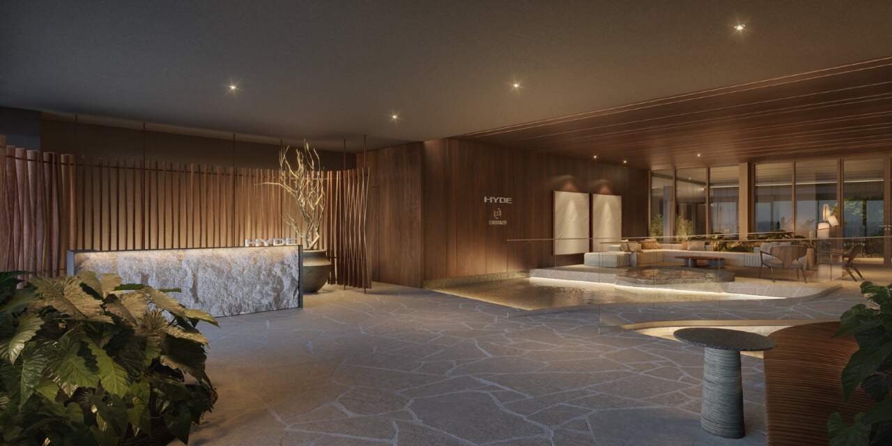 Apartamento à venda no Centro: Hall social do Hyde, com recepção em pedra e pé-direito alto (imagem ilustrativa)