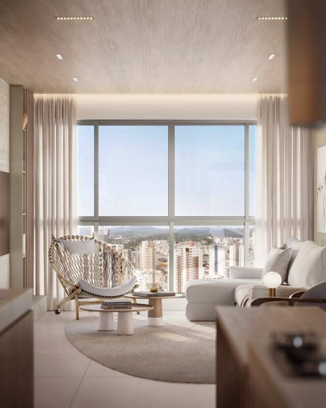 Apartamento à venda no Centro: Estar do apartamento tipo com poltrona e sofá junto à janela (imagem ilustrativa)