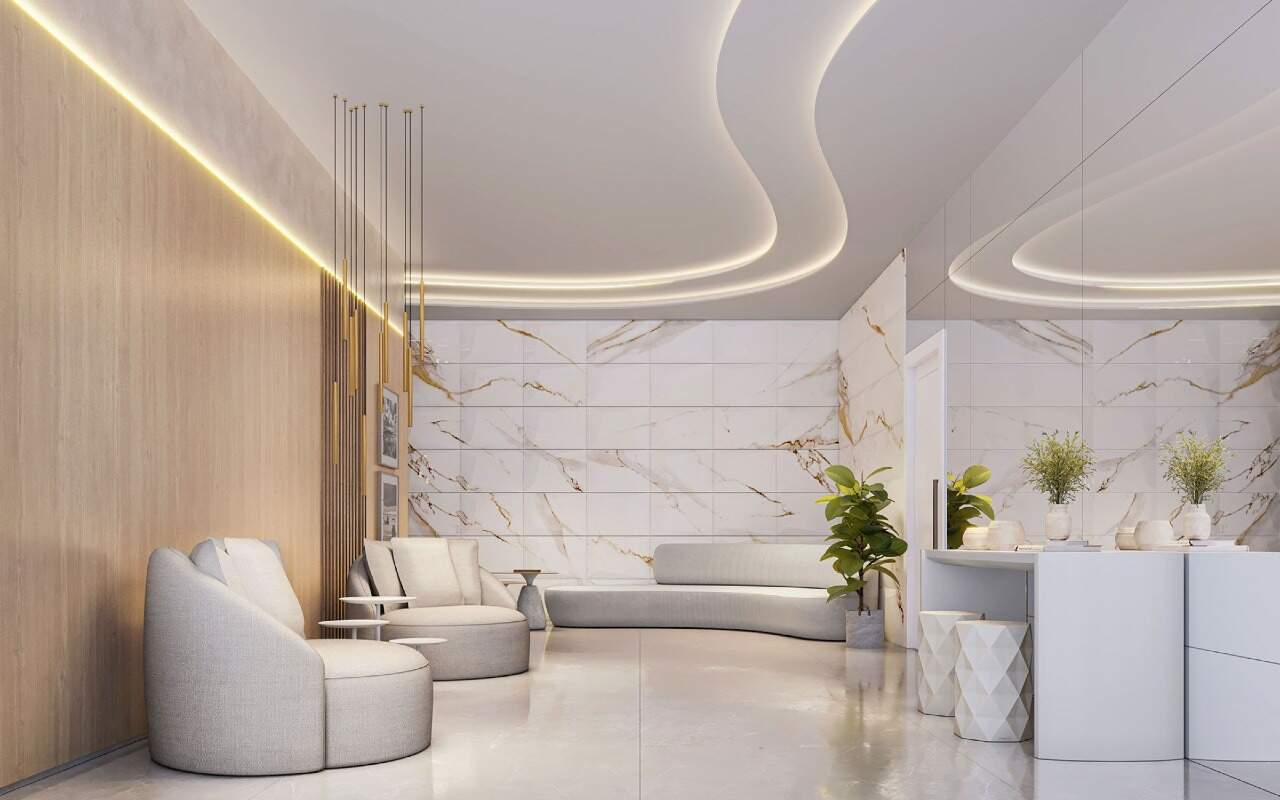 Apartamento diferenciado à venda no Centro: Lounge do lazer com poltronas e parede de mármore (imagem ilustrativa)
