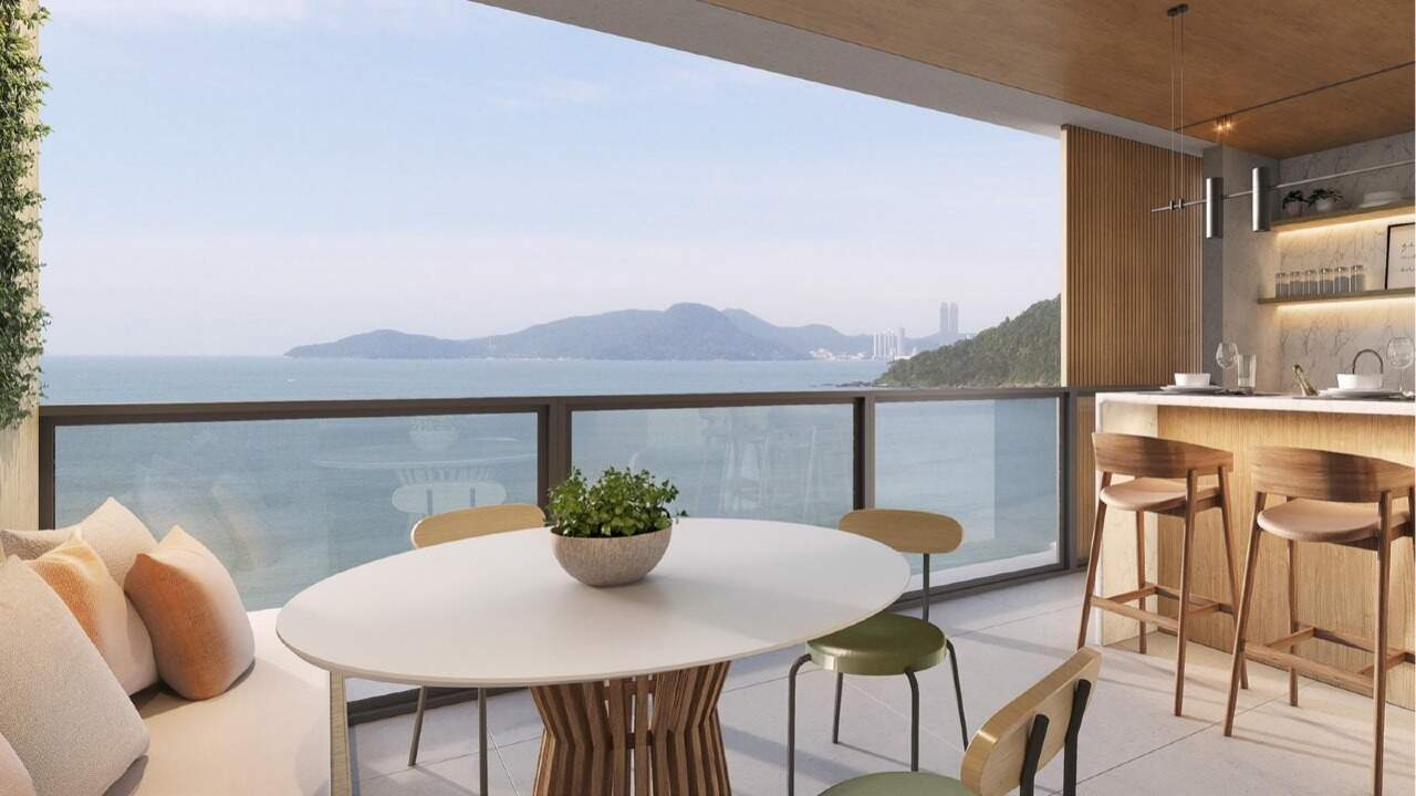 Apartamento à venda no Praia Brava: Sacada gourmet do apartamento tipo, com mesa e vista para o mar (imagem ilustrativa)