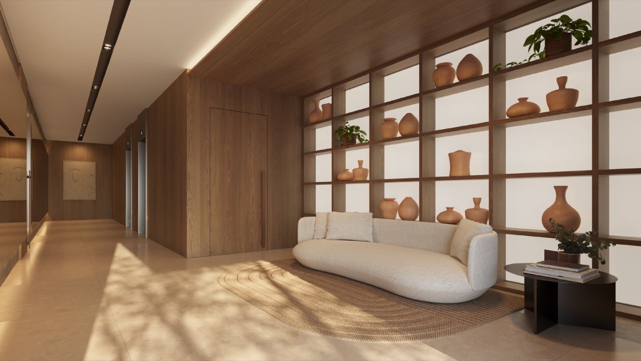 Apartamento à venda no Centro: Hall de entrada decorado, com estante de cerâmicas e sofá curvo (imagem ilustrativa)