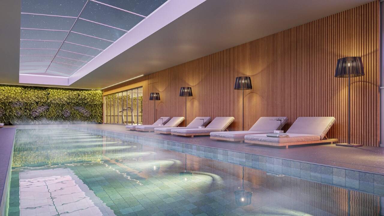 Apartamento à venda no Fazenda: Piscina aquecida coberta com espreguiçadeiras (imagem ilustrativa)