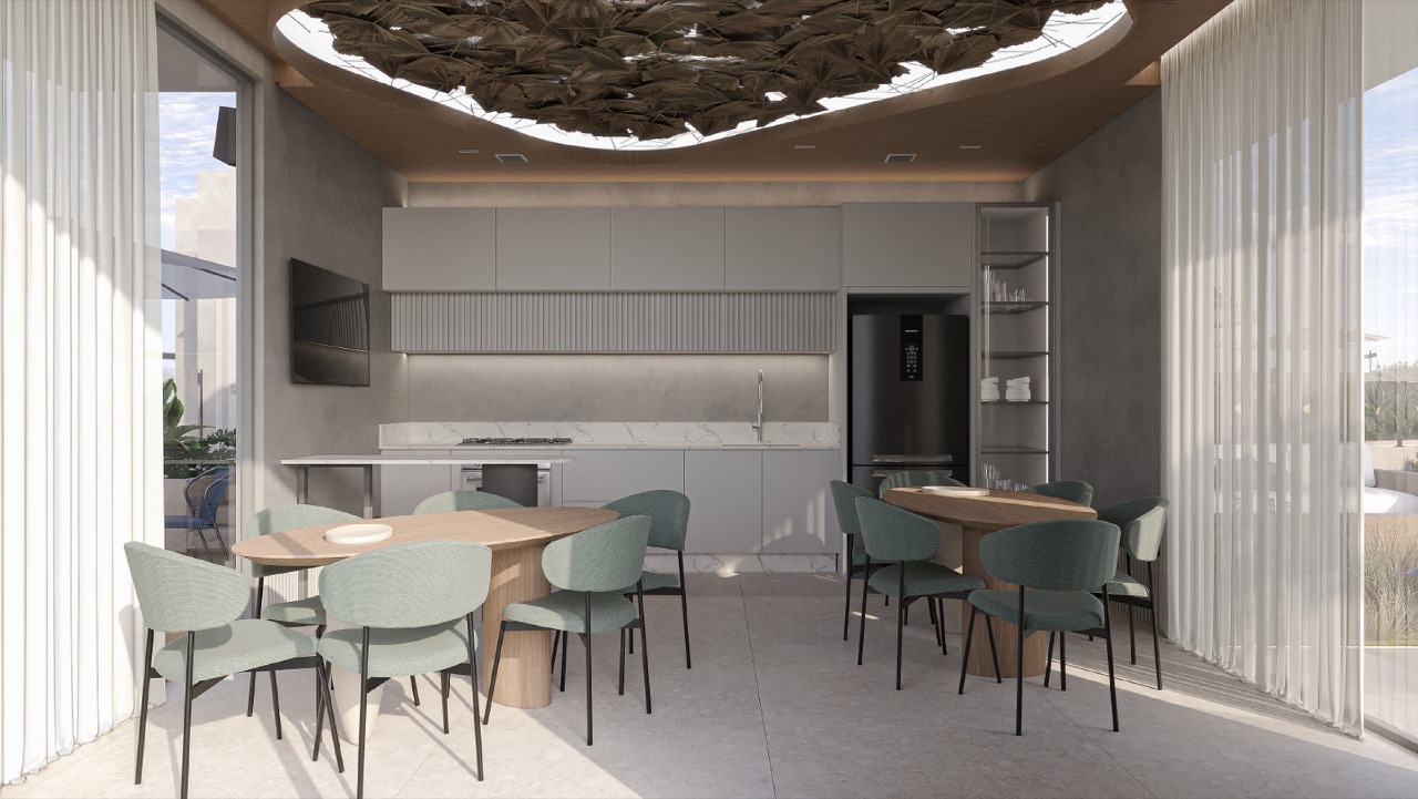 Apartamento à venda no Pioneiros: Espaço gourmet com mesas e cozinha (imagem ilustrativa)