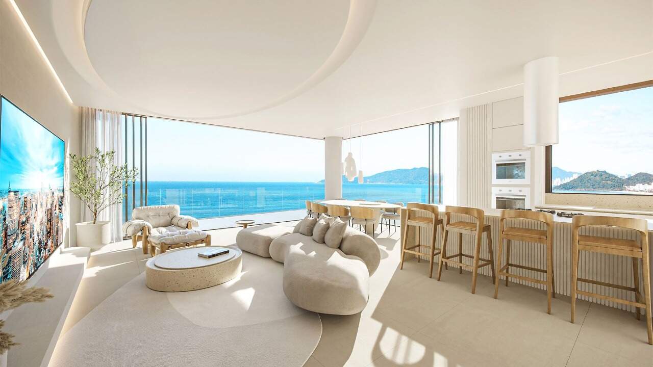 Apartamento diferenciado à venda no Praia Brava: Living com cozinha integrada e vista para o mar (imagem ilustrativa)