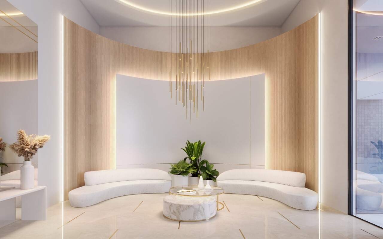 Apartamento à venda no Centro: Hall de entrada com sofás curvos e pé-direito iluminado (imagem ilustrativa)