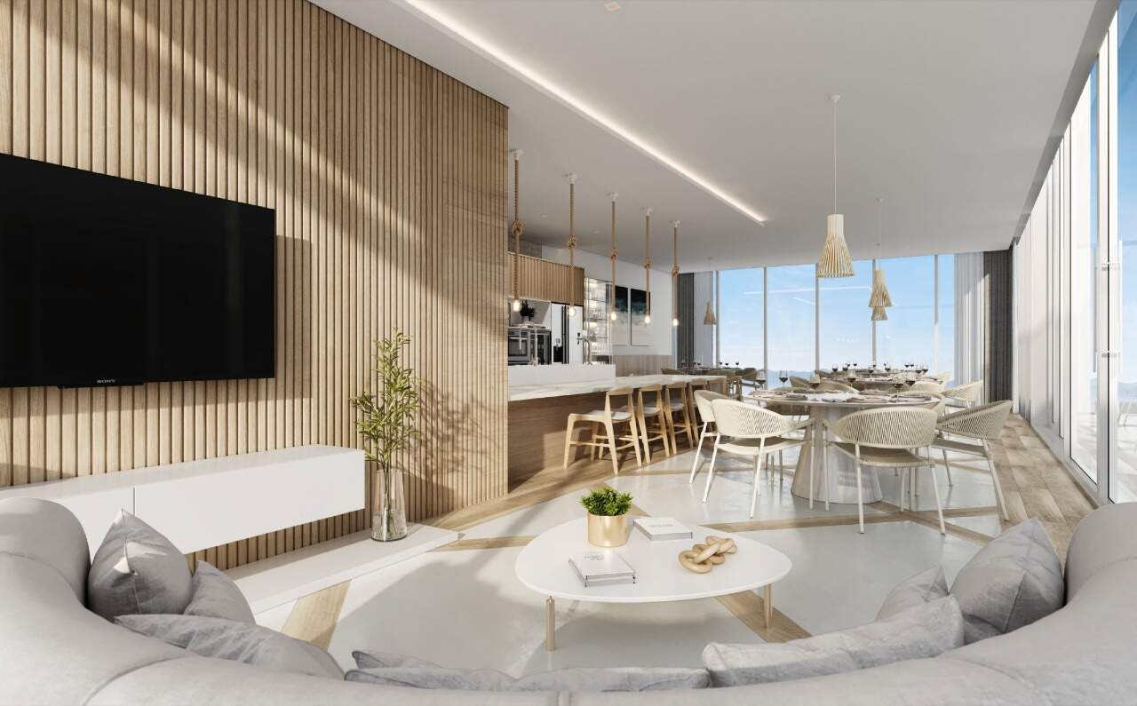 Apartamento à venda no Centro: Quiosque do lazer com estar, TV e mesas junto aos vidros (imagem ilustrativa)