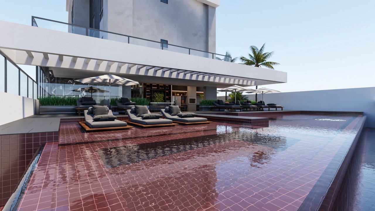 Apartamento à venda no Centro: Piscina bordô com prainha e espreguiçadeiras (imagem ilustrativa)