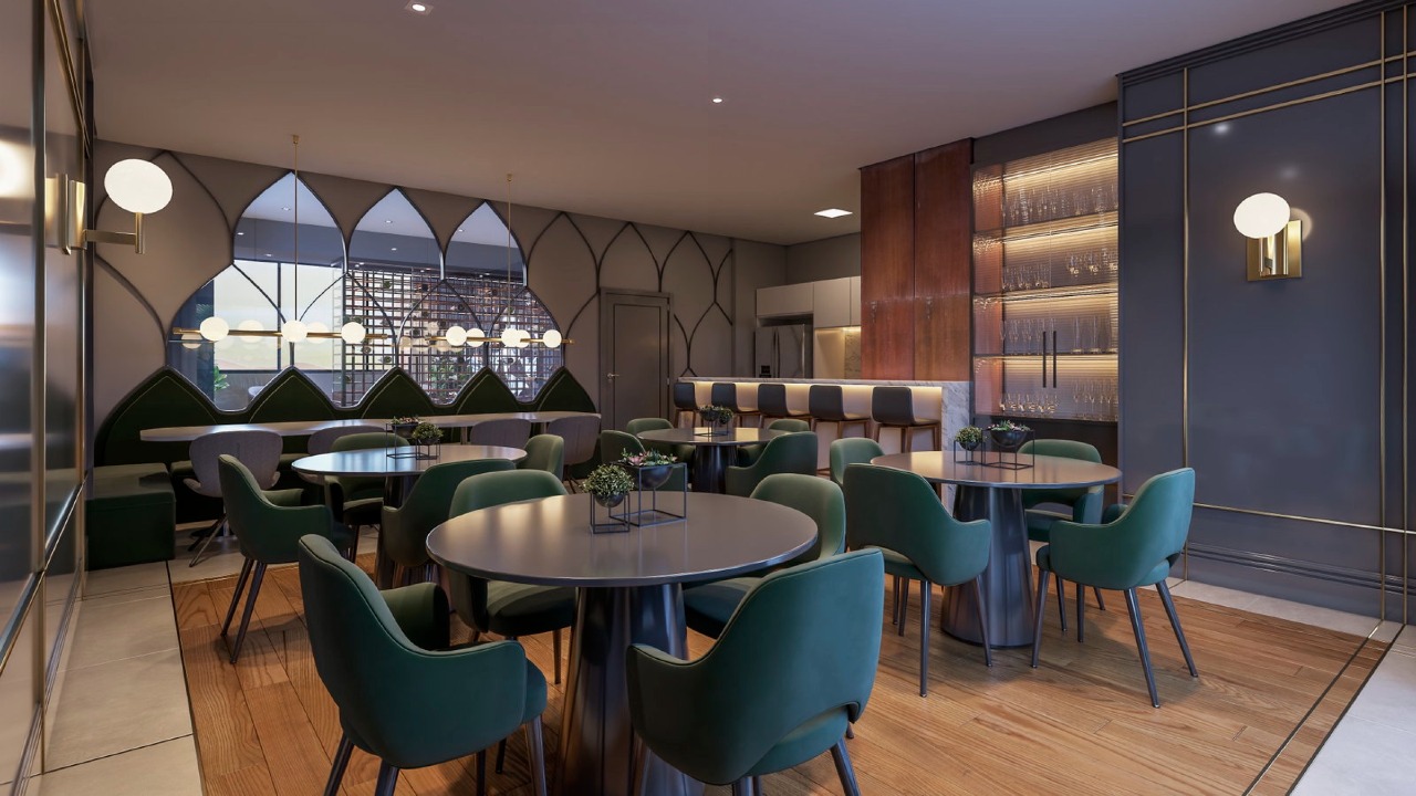Apartamento à venda no Centro: Espaço gourmet com mesas redondas e poltronas verdes (imagem ilustrativa)