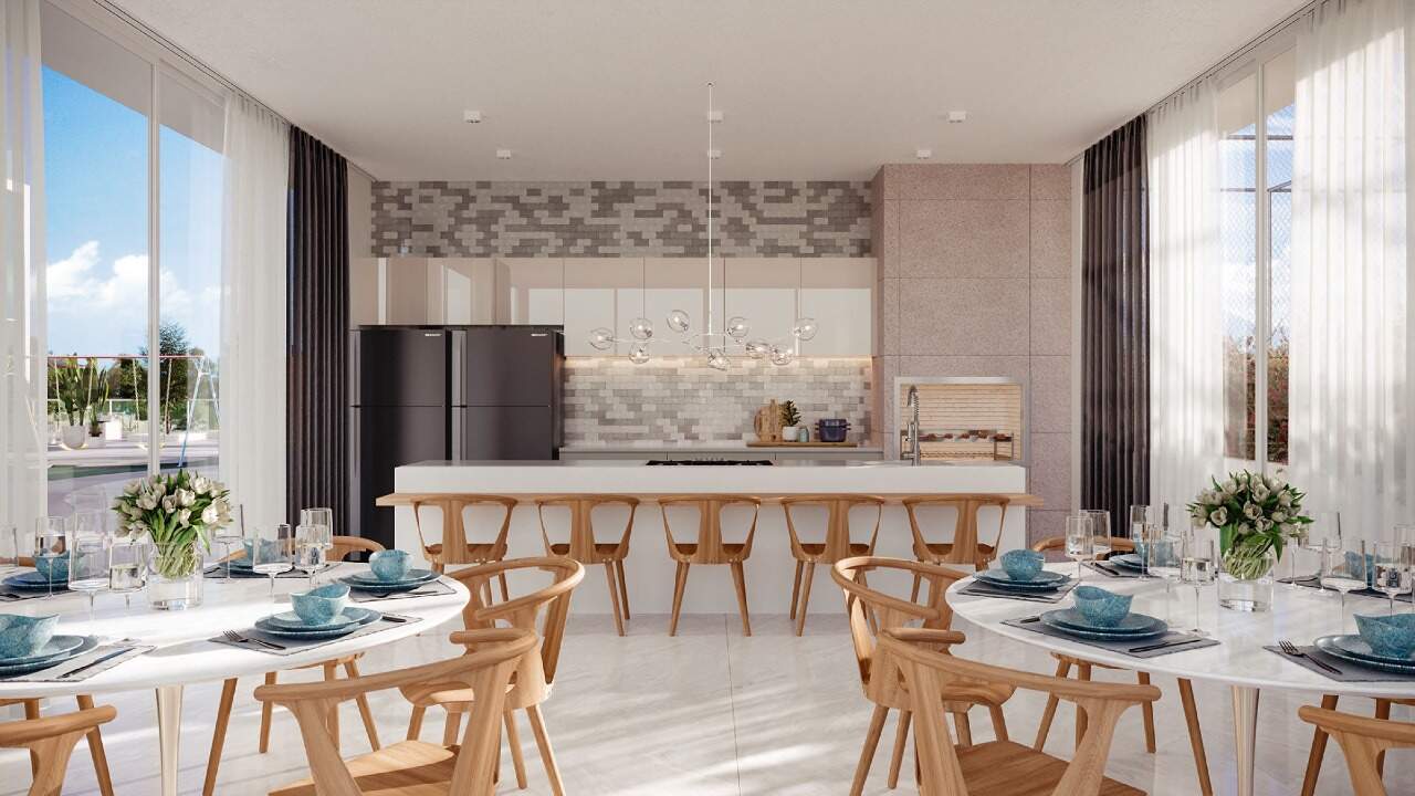 Apartamento à venda no Centro: Espaço gourmet com cozinha, bancada e mesas redondas (imagem ilustrativa)