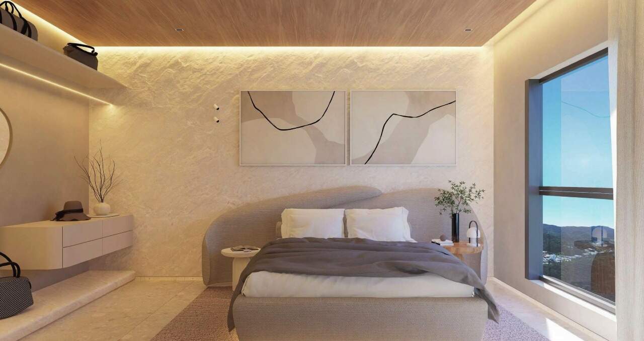 Apartamento à venda no Pioneiros: Suíte com cabeceira curva e iluminação indireta (imagem ilustrativa)