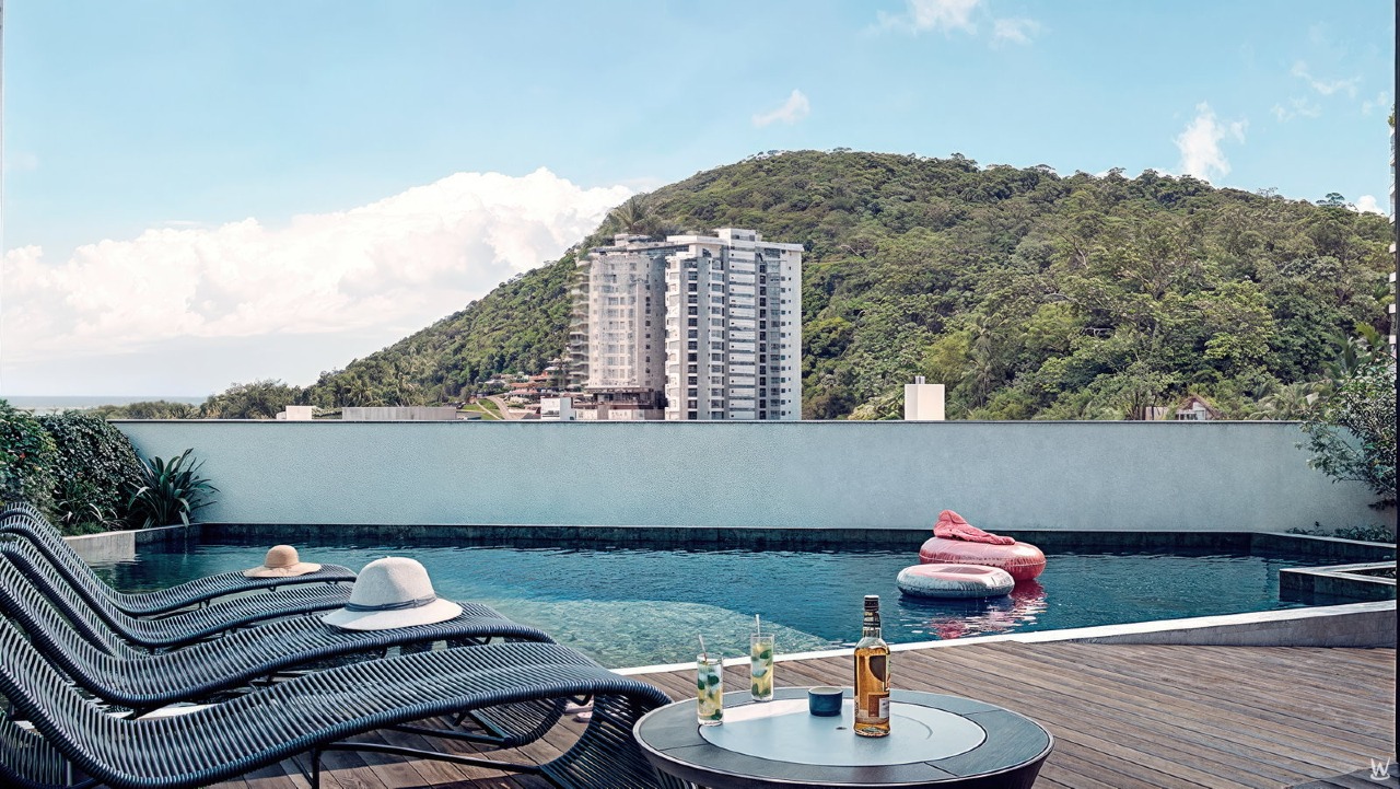 Apartamento à venda no Fazenda: Piscina do pavimento de lazer, com espreguiçadeiras e o morro ao fundo (imagem ilustrativa)