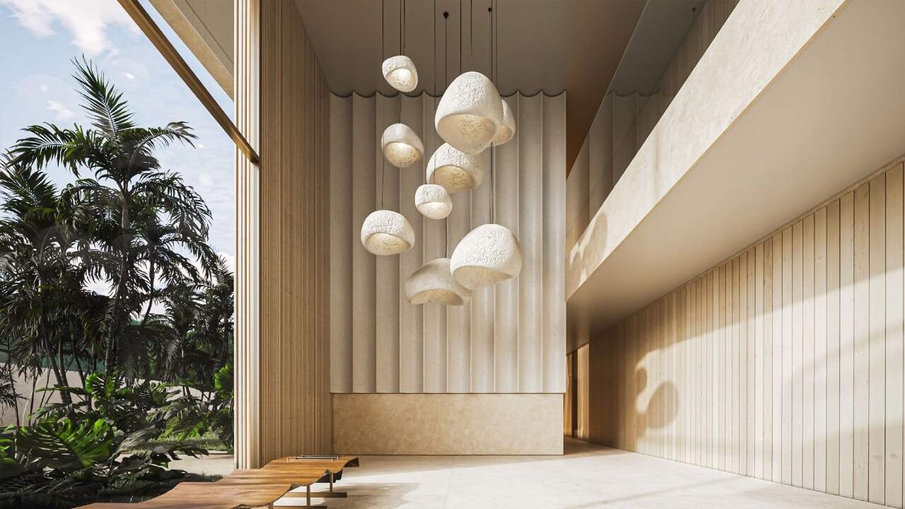 Apartamento diferenciado à venda no Praia Brava: Hall de entrada com pé-direito alto e luminárias pendentes (imagem ilustrativa)