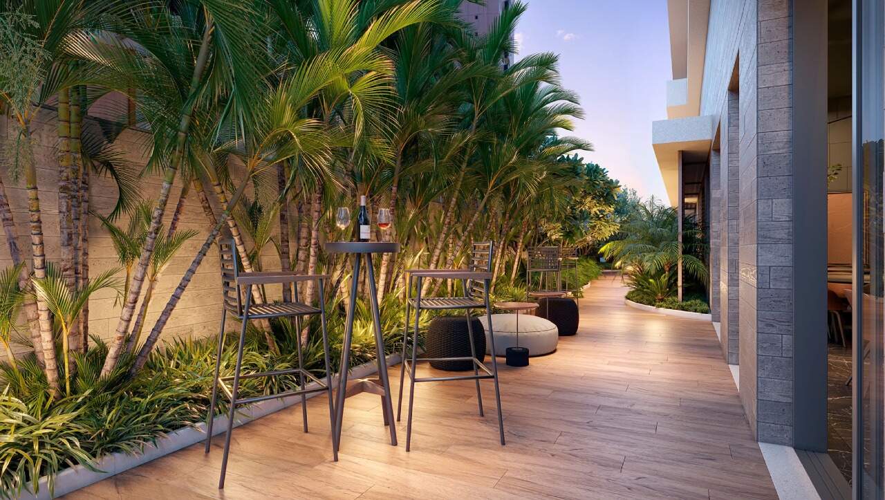 Apartamento à venda no Centro: Caminho de jardim com mesa alta no pavimento de lazer (imagem ilustrativa)