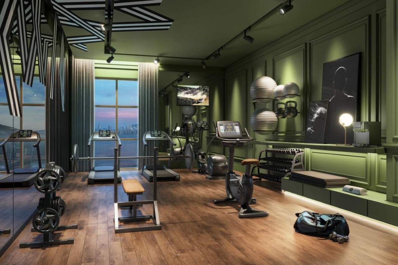 Apartamento à venda no Pioneiros: Academia com esteiras, bicicletas e pesos livres (imagem ilustrativa)