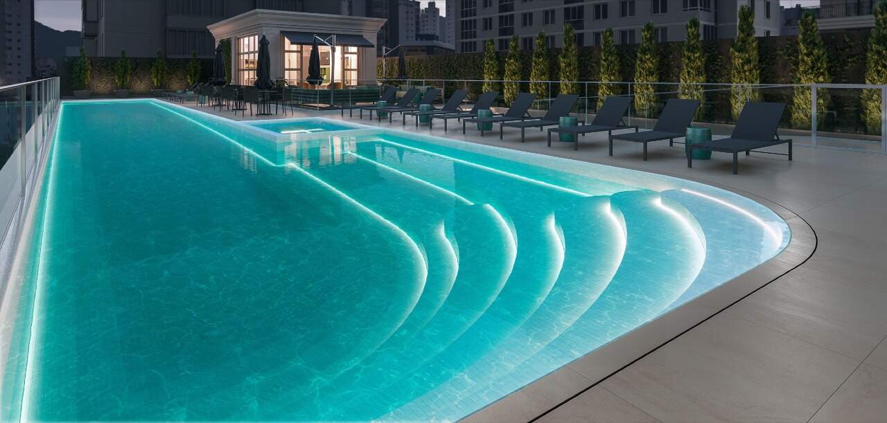 Apartamento à venda no Pioneiros: Piscina com iluminação noturna e hidromassagem externa (imagem ilustrativa)