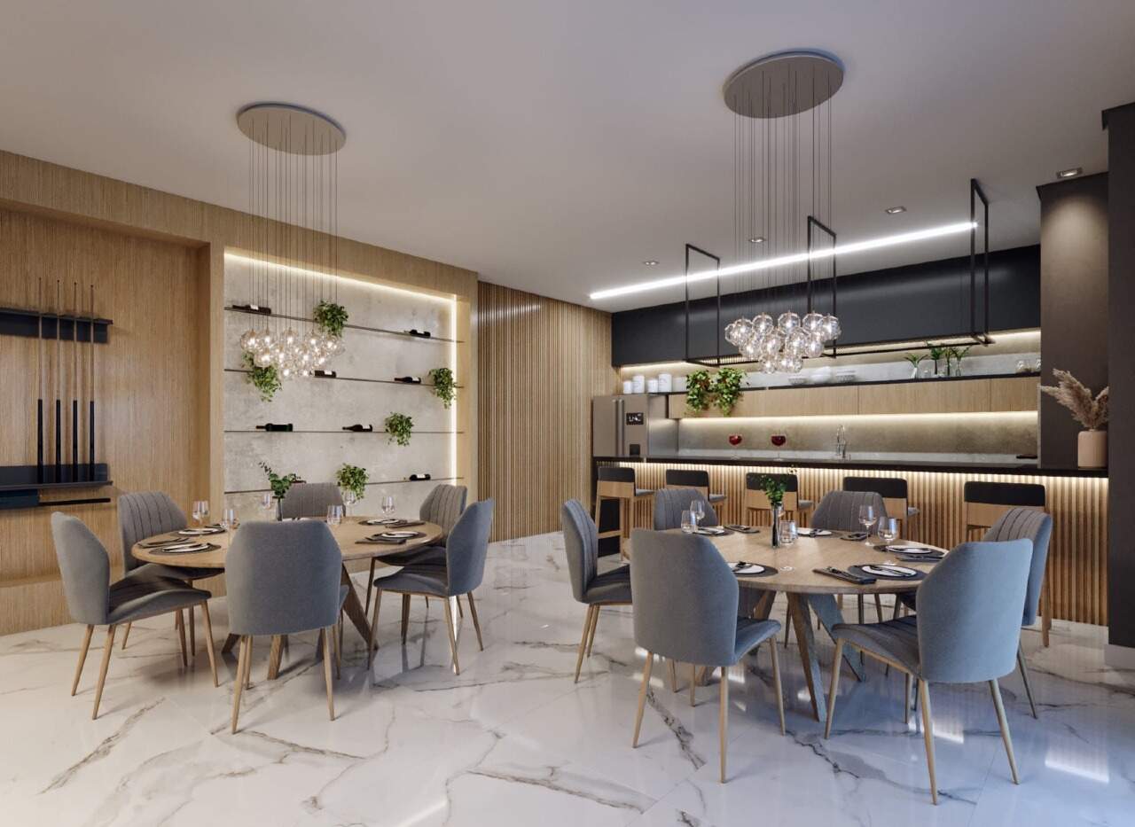 Apartamento à venda no Centro: Espaço gourmet com mesas redondas e bar (imagem ilustrativa)