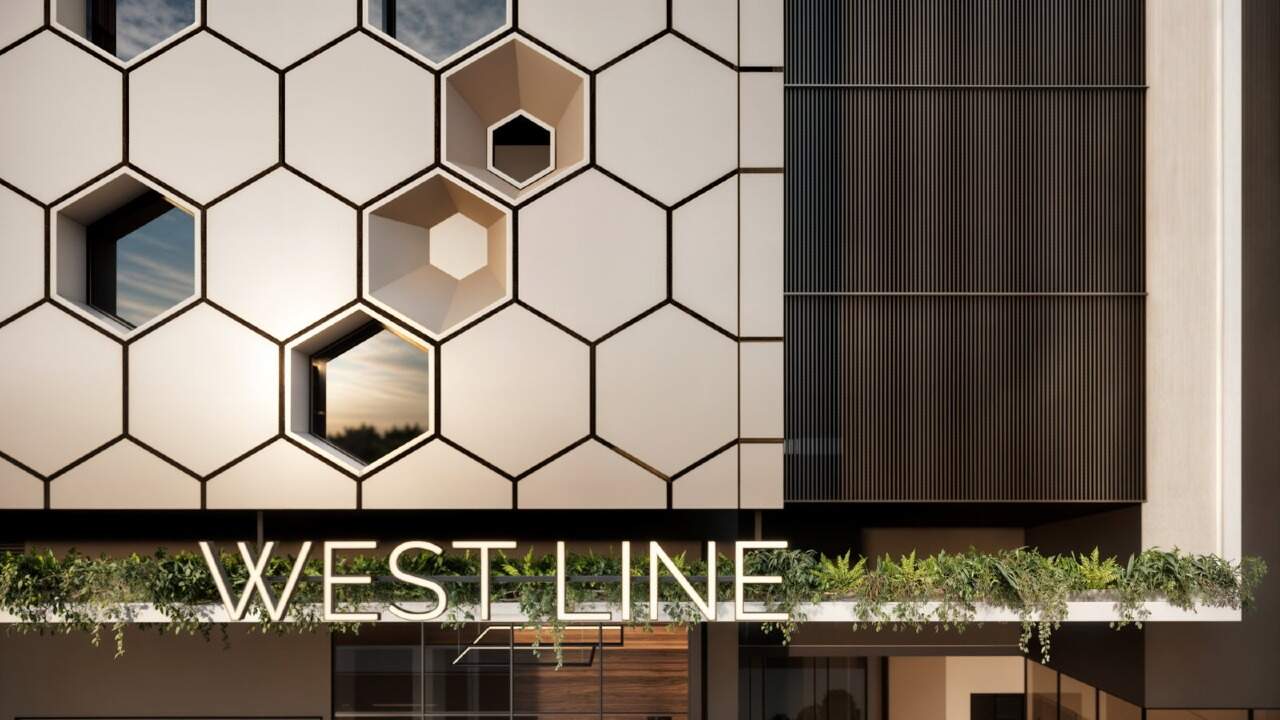 Apartamento à venda no Fazenda: Painéis hexagonais da fachada e letreiro do West Line (imagem ilustrativa)