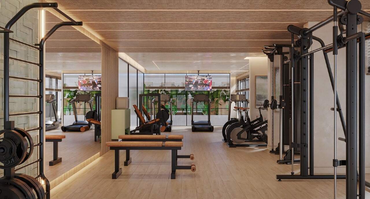 Apartamento à venda no Centro: Academia com aparelhos de musculação e esteiras (imagem ilustrativa)