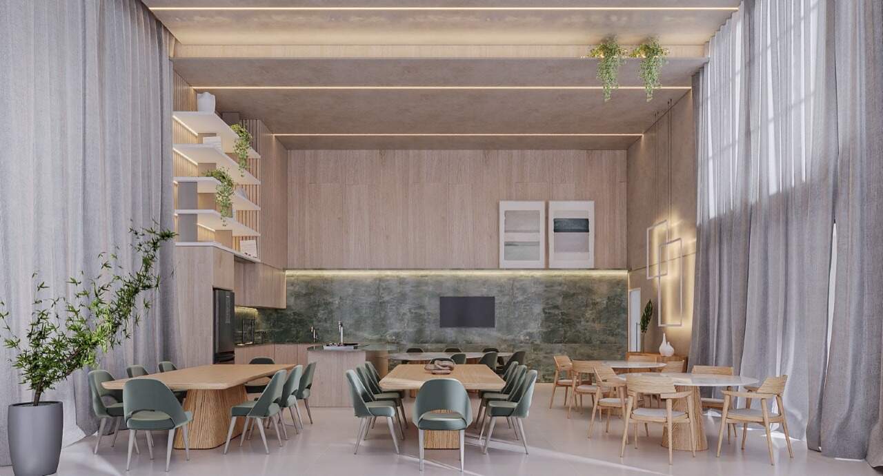 Apartamento à venda no Centro: Salão de festas com mesas, bancada e parede verde (imagem ilustrativa)