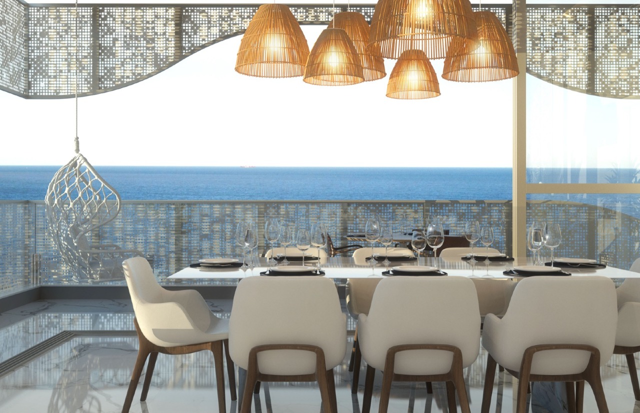 Cobertura à venda no Praia Brava: Mesa de jantar junto à sacada com vista para o mar (imagem ilustrativa)