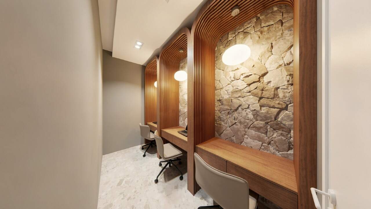 Apartamento diferenciado à venda no Centro: Coworking com estações de trabalho e parede de pedra (imagem ilustrativa)
