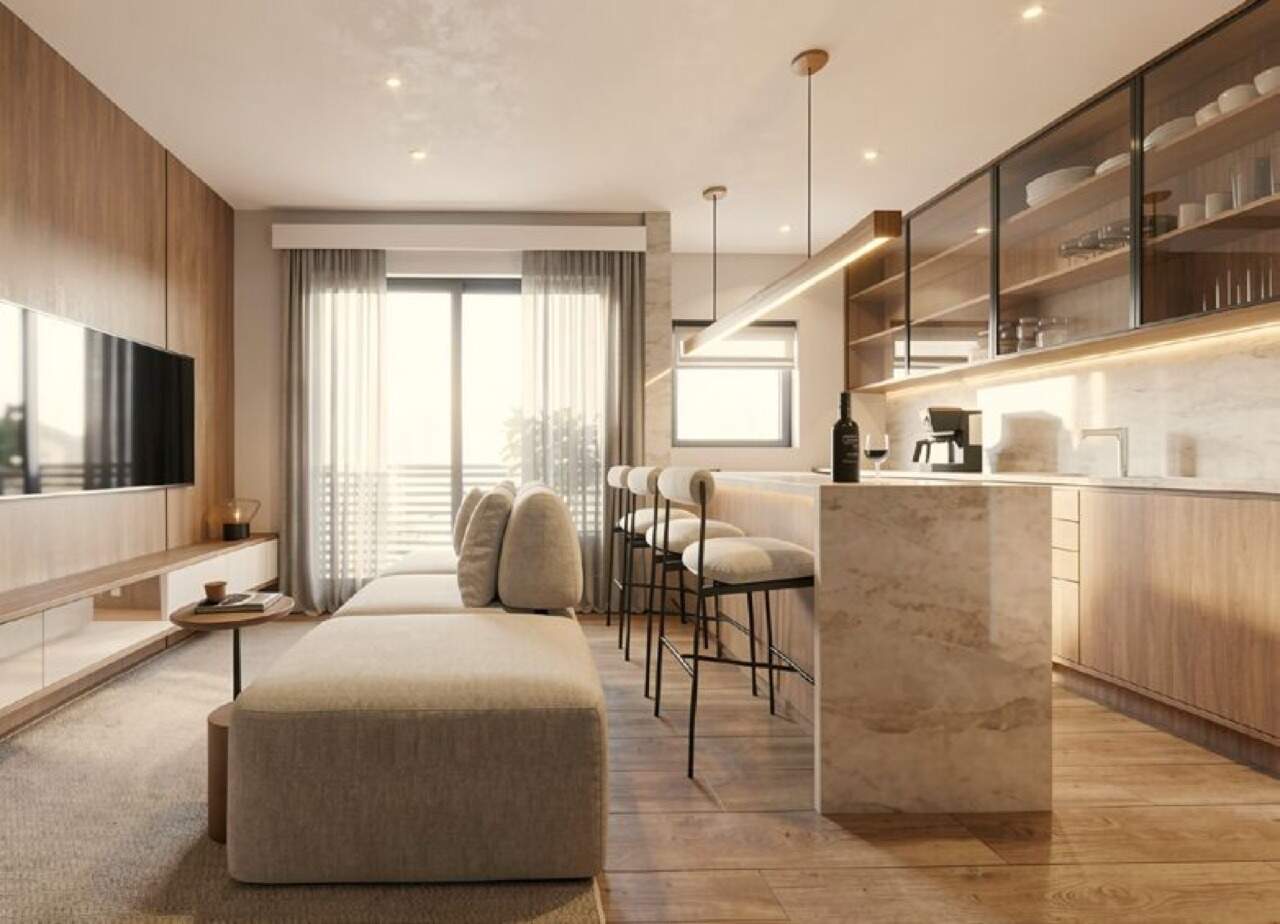 Apartamento à venda no Centro: Living com bancada em apartamento com sacada de planta semelhante (imagem ilustrativa)