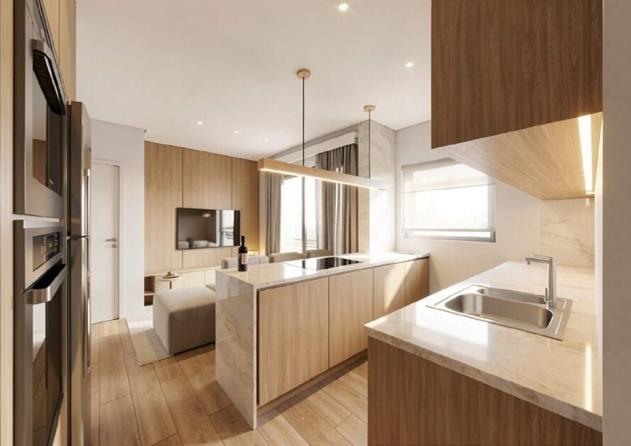 Apartamento à venda no Centro: Cozinha com ilha em apartamento com sacada de planta semelhante (imagem ilustrativa)