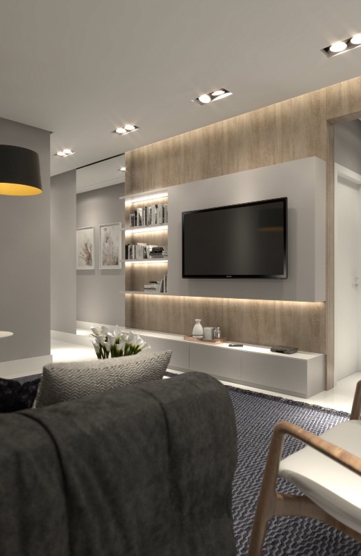 Apartamento diferenciado à venda no Cabeçudas: Living com painel de TV (imagem ilustrativa)
