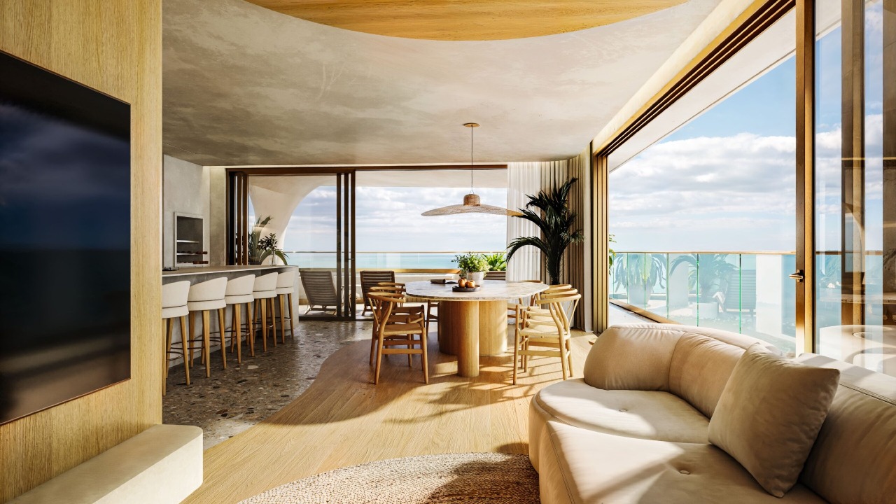 Apartamento diferenciado à venda no Cabeçudas: Living integrado com vista para o mar (imagem ilustrativa)