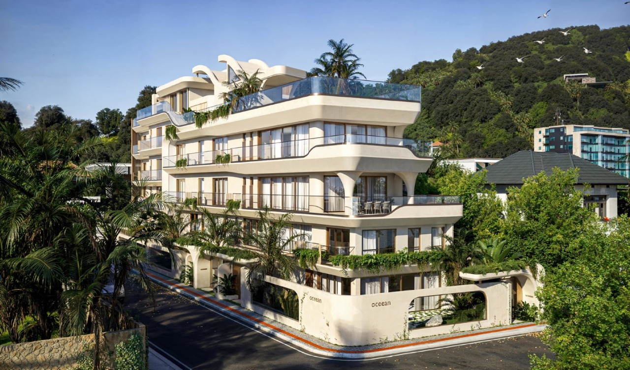 Apartamento à venda no Cabeçudas: Fachada do Oceean com terraços curvos e o morro ao fundo (imagem ilustrativa)