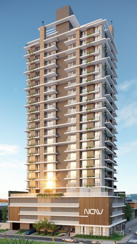 Apartamento à venda no Centro: Torre do NOW Residence ao entardecer, com o embasamento iluminado (imagem ilustrativa)