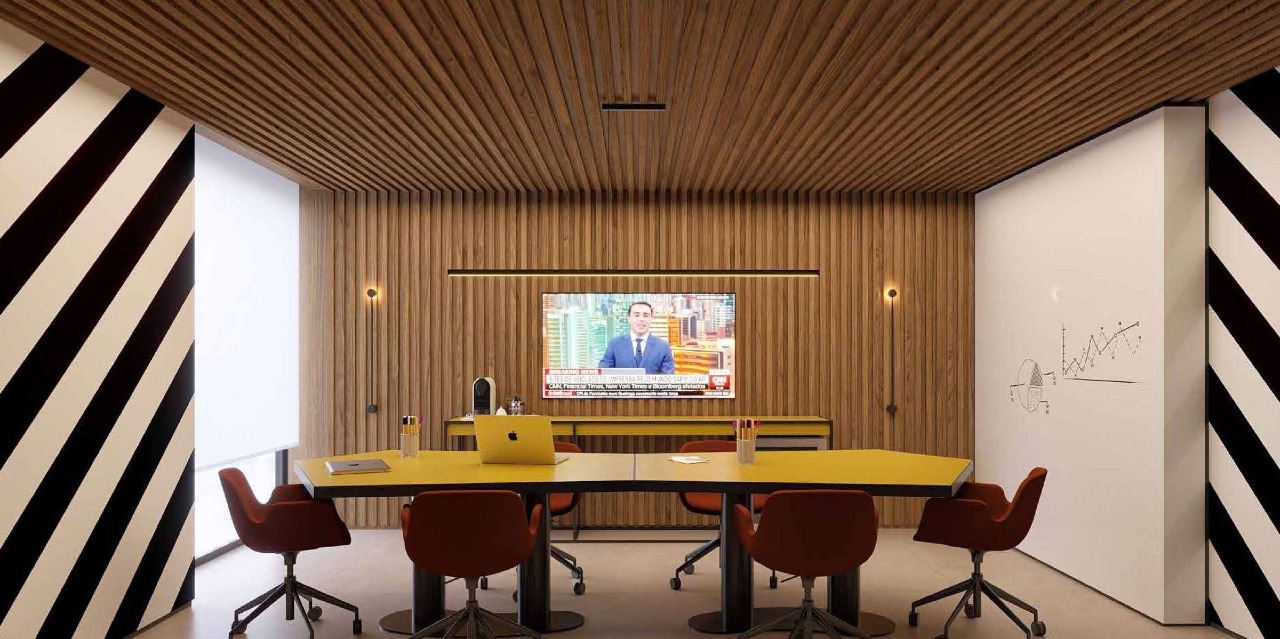 Apartamento à venda no Centro: Sala de reuniões do coworking com mesa amarela e painéis listrados (imagem ilustrativa)