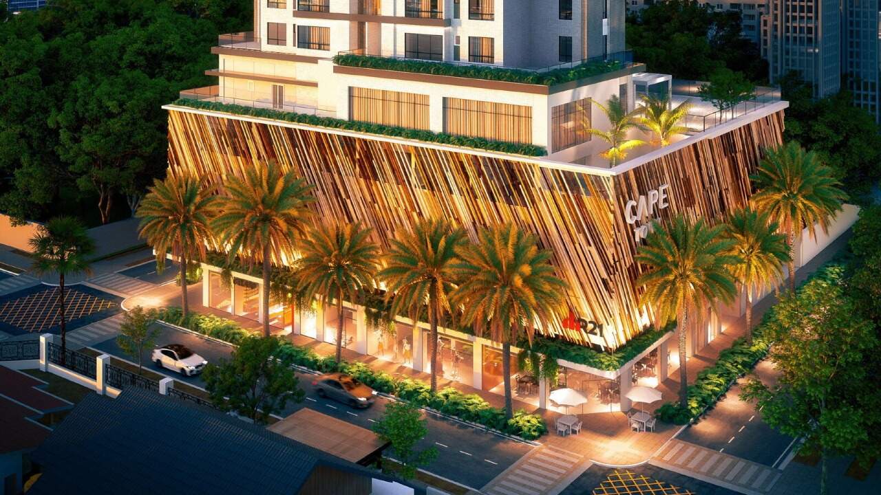 Apartamento à venda no Centro: Base do Cape Town iluminada à noite, com palmeiras e ripas de madeira (imagem ilustrativa)