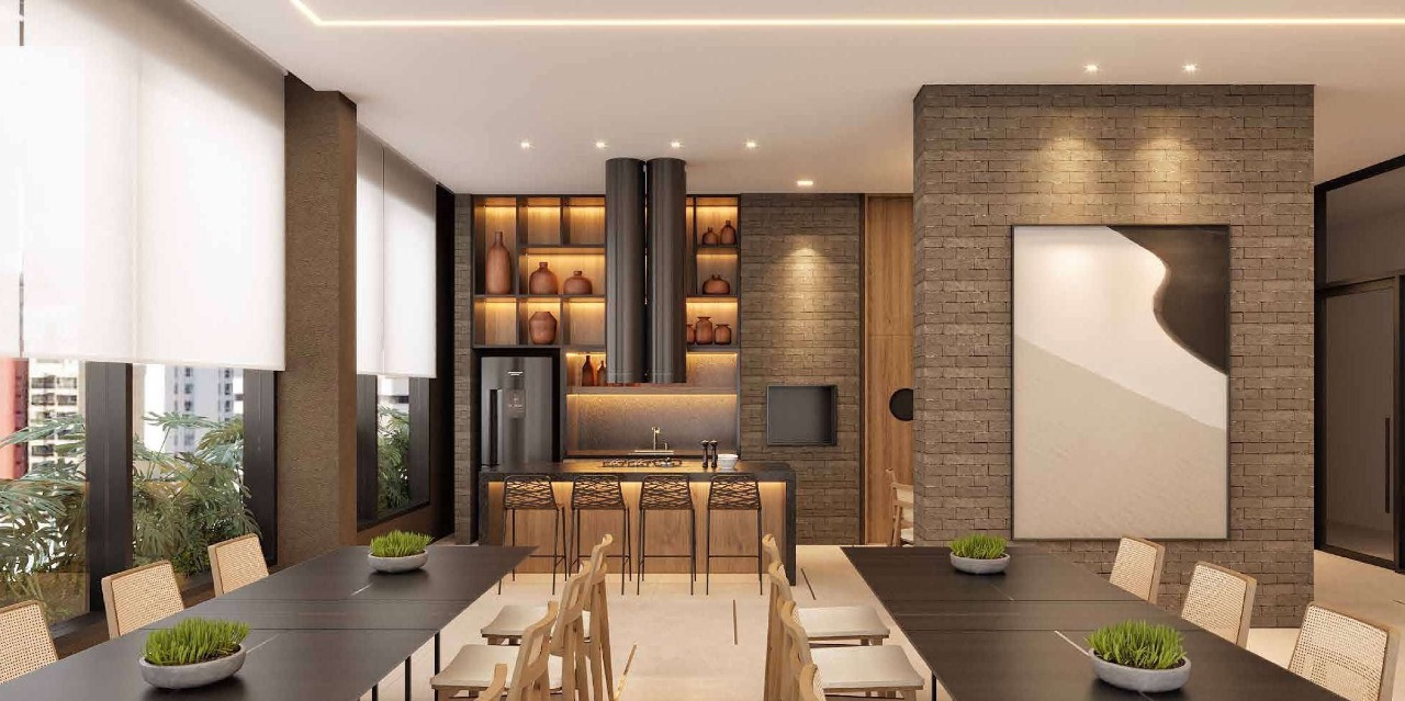 Apartamento à venda no Centro: Salão de festas com mesa comprida, cozinha e painel de pedra (imagem ilustrativa)