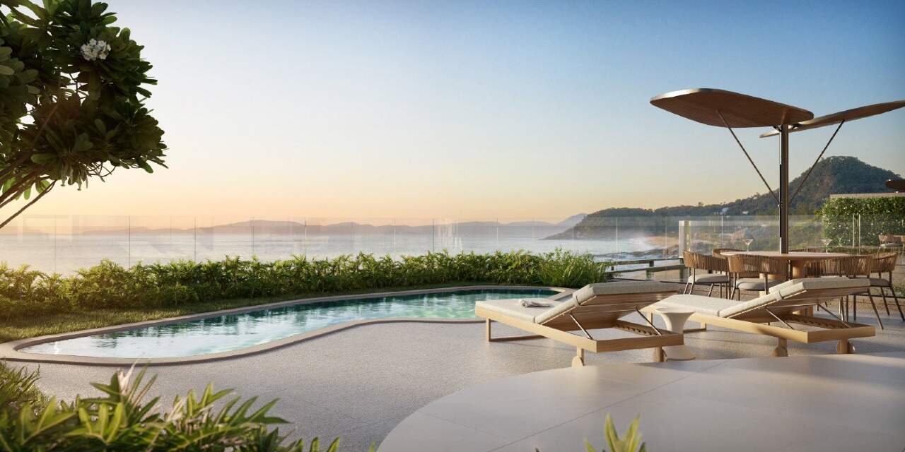 Apartamento à venda no Praia do Estaleiro: Piscina com guarda-sol e deck ao pôr do sol (imagem ilustrativa)