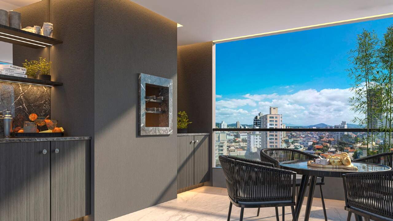 Apartamento à venda no Centro: Sacada com mesa e vista da cidade (imagem ilustrativa)