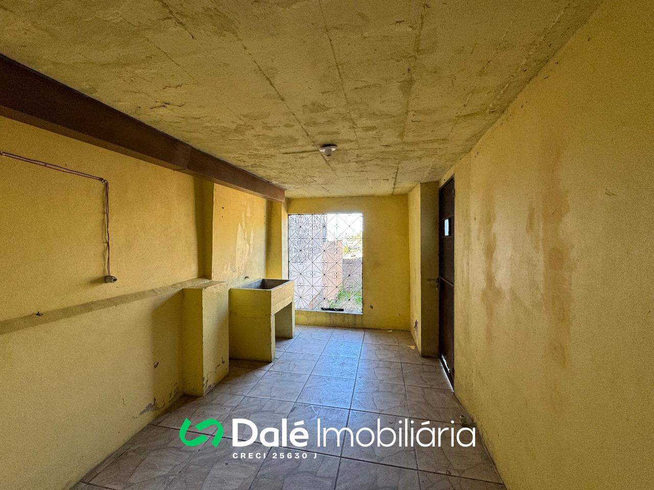 Casa à venda no Centro: lavanderia