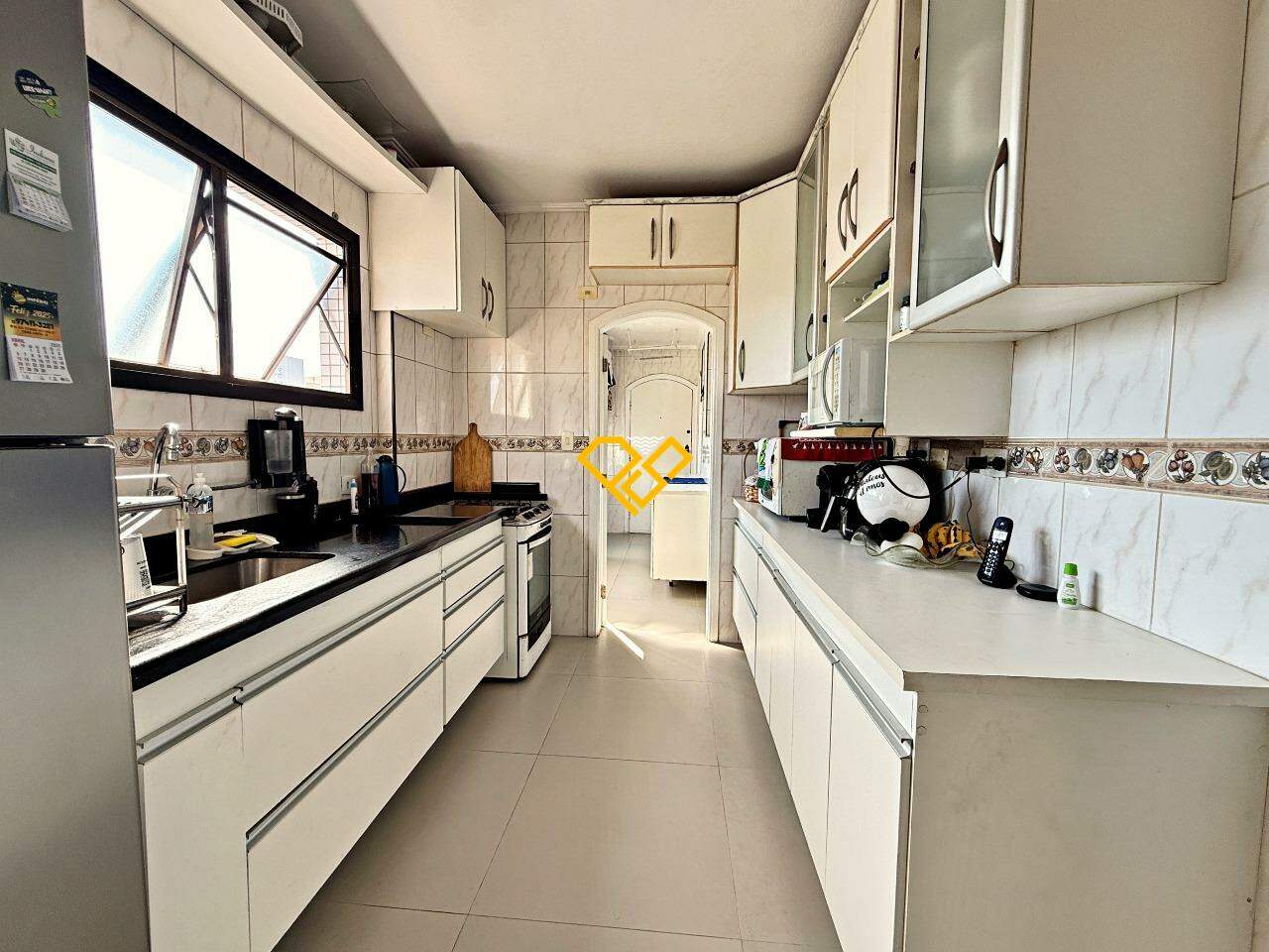 Cobertura à venda no Ponta da Praia: Cozinha - 1° piso