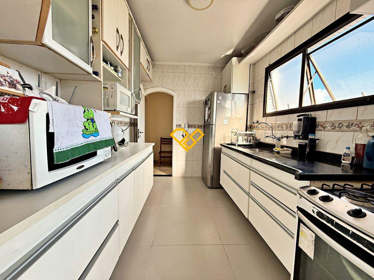 Cobertura à venda no Ponta da Praia: Cozinha - 1° piso